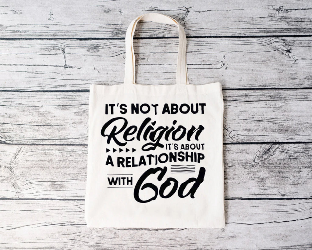 It's Not About Religion Tote (Black Letters)